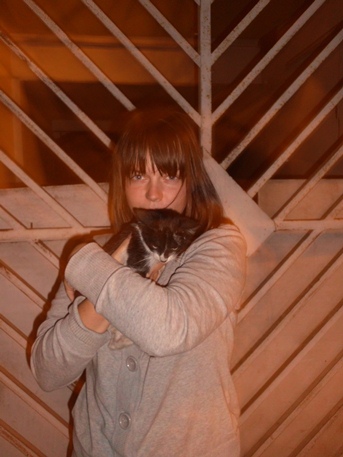 Our roommate Emma in Lima with a cat.