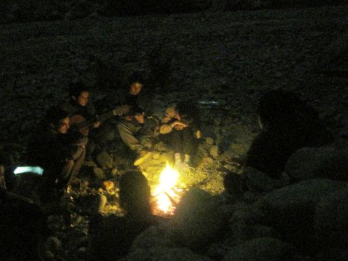 Our group of travelers around the fire in Nazca, Peru.